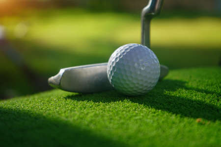 Golf balls on the golf course with golf clubs ready for golf in the first short. In the morning, with the beautiful sunlight.の写真素材
