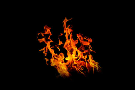 Fire flames on black background. abstract fire flame background. The fire in the fire burning naturally waved at night.の写真素材