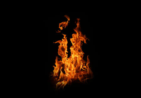 Fire flames on black background. abstract fire flame background. The fire in the fire burning naturally waved at night.の写真素材