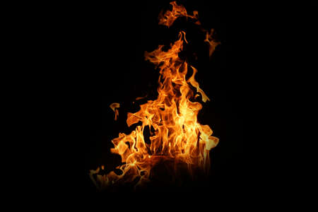 Fire flames on black background. abstract fire flame background. The fire in the fire burning naturally waved at night.の写真素材