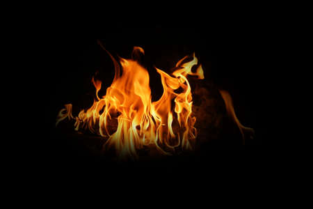 Fire flames on black background. abstract fire flame background. The fire in the fire burning naturally waved at night.の写真素材