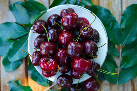 Berry Cherry on a wooden table rustic. Natural detox, fruit dessert, healthy dieting concept. Top view flat lay background. Banner.の写真素材