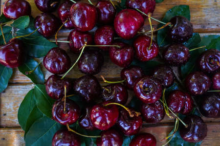 Berry Cherry on a wooden table rustic. Natural detox, fruit dessert, healthy dieting concept. Top view flat lay background. Banner.の写真素材