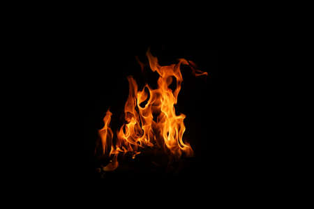 Fire flames on black background. abstract fire flame background. The fire in the fire burning naturally waved at night.の写真素材