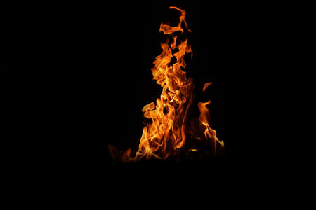 Fire flames on black background. abstract fire flame background. The fire in the fire burning naturally waved at night.の写真素材
