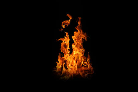 Fire flames on black background. abstract fire flame background. The fire in the fire burning naturally waved at night.の写真素材