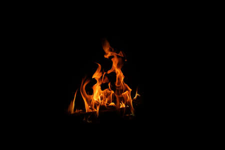 Fire flames on black background. abstract fire flame background. The fire in the fire burning naturally waved at night.の写真素材