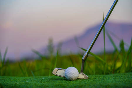 Wooden floor and golf course background. Fresh spring green golf course with wood floor. Beauty natural background, Empty wooden deck table with Green background.の写真素材