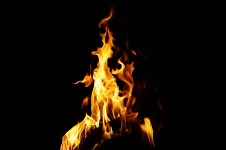 Burning flame or fire isolated on black background. stack of thermal energy close-up, red and yellow, heat energy igniting fuel during night/light on black backgroundの写真素材