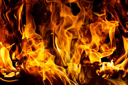 Burning flame or fire isolated on black background. stack of thermal energy close-up, red and yellow, heat energy igniting fuel during night/light on black backgroundの写真素材