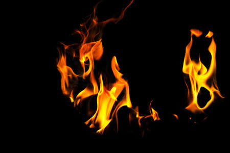Burning flame or fire isolated on black background. stack of thermal energy close-up, red and yellow, heat energy igniting fuel during night/light on black backgroundの写真素材