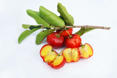 Fresh acerola fruit, typical from Brazil. Red organic Acerola Cherry with half slice and green...