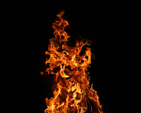 Fire flames on black background. abstract fire flame background. The fire in the fire burning naturally waved at night.の写真素材