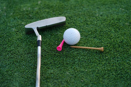 Golf balls on the golf course with golf clubs ready for golf in the first short. In the morning,...