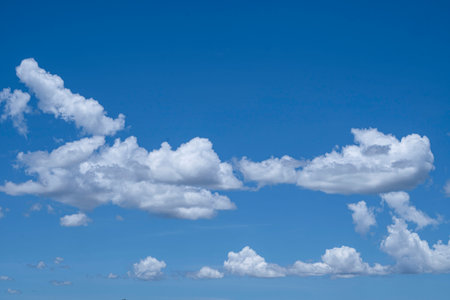 Blue sky with white clouds. Sky and clouds during the daytime in the summer. white fluffy clouds in the blue sky.の写真素材