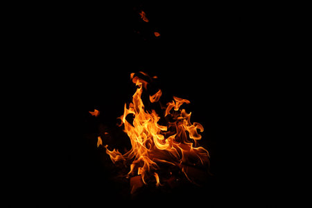 Fire flames on black background. abstract fire flame background. The fire in the fire burning naturally waved at night.の写真素材
