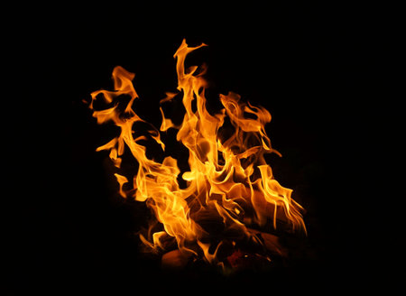 Fire flames on black background. abstract fire flame background. The fire in the fire burning naturally waved at night.の写真素材