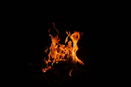 Fire flames on black background. abstract fire flame background. The fire in the fire burning naturally waved at night.の写真素材
