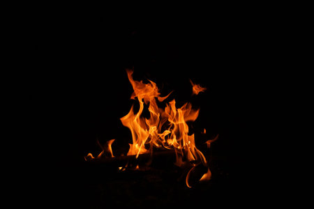 Fire flames on black background. abstract fire flame background. The fire in the fire burning naturally waved at night.の写真素材