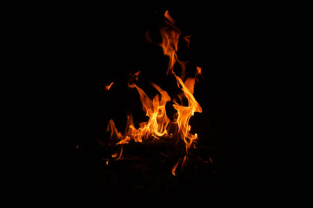 Fire flames on black background. abstract fire flame background. The fire in the fire burning naturally waved at night.の写真素材