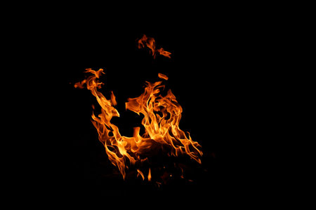 Fire flames on black background. abstract fire flame background. The fire in the fire burning naturally waved at night.の写真素材