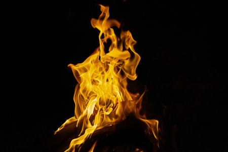 Burning flame or fire isolated on black background. stack of thermal energy close-up, red and yellow, heat energy igniting fuel during night,light on black backgroundの写真素材
