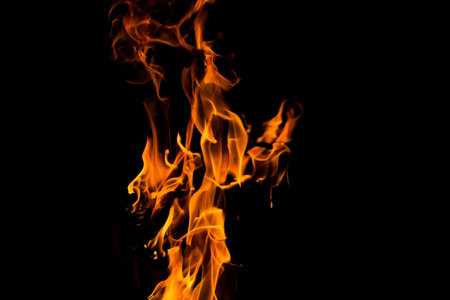 Burning flame or fire isolated on black background. stack of thermal energy close-up, red and yellow, heat energy igniting fuel during night,light on black background.の写真素材