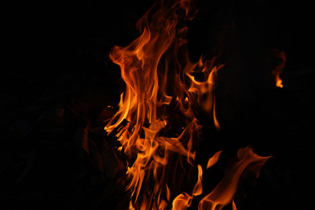 Burning flame or fire isolated on black background. stack of thermal energy close-up, red and yellow, heat energy igniting fuel during night,light on black background.の写真素材