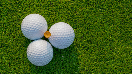 Green grass with golf ball closeup in soft focus when sunlight Playground for golf course concept , Wide landscape as background for your character about playing golf.の写真素材