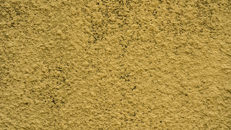 Colorful vintage style concrete wall, bright yellow of cement floor paint with micro-textured details.の写真素材