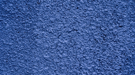 Beautiful abstract grungy blue stucco wall background, cool mood. pantone of the year color concept background with space for text.の写真素材
