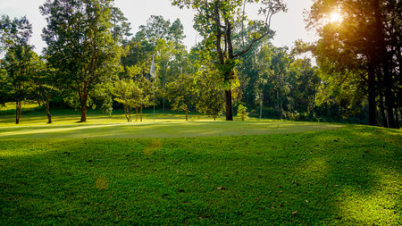 View of golf course with beautiful putting green. Golf course with a rich green turf beautiful scenery.の写真素材