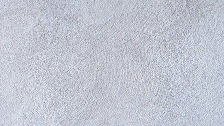 White cement wall in retro concept. Old concrete background for wallpaper or graphic design. Modern house interiors that feel calm and simpleの写真素材