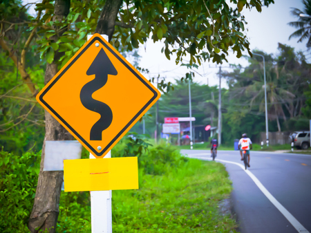 traffic sign for curve road on the roadの写真素材