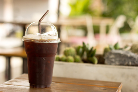 Iced Americano black coffee on a wooden tableの写真素材