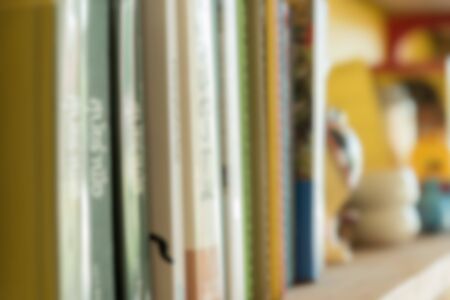 Blurred abstract background of book shelves row and interior of college library with textbooksの写真素材