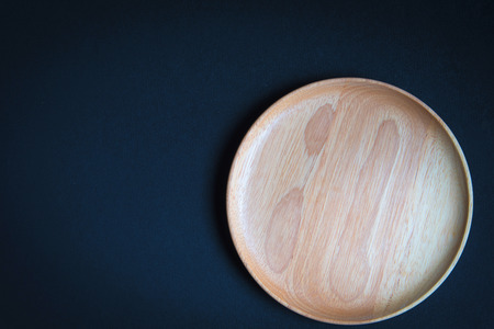 Wood plate on wooden tableの写真素材