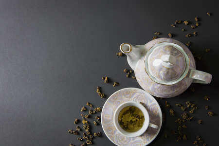 Tea cup and teapot on stone table