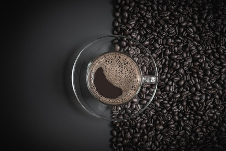 espresso in a glass on wooden tableの写真素材