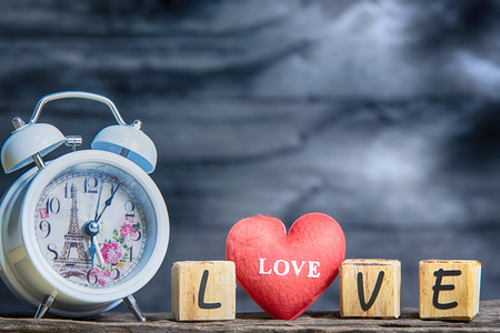 Letters spelling love. red heart and Wooden letters spelling loveの写真素材