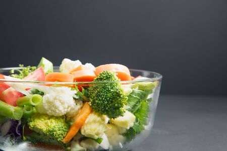 healthy foods are on the table, Fresh vegetable salad in a glass bowの写真素材