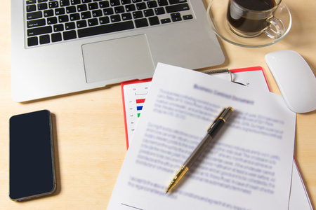 Businessman is signing a contract, business contract detailsの写真素材