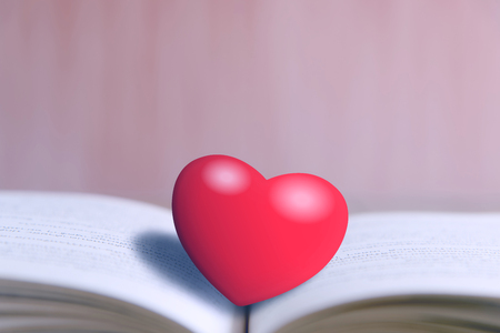 Heart of the book on wooden tableの写真素材
