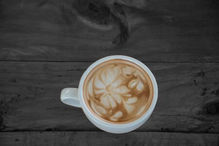 Coffee cup on woodden table, Latte Coffee on wood tableの写真素材