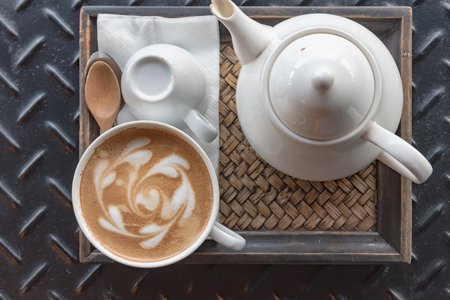 Cup of coffee latte in coffee shopの写真素材
