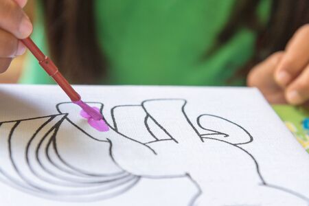 Creative ideas and learning. Education concept. Child's hands drawing. Colorful picture made by kids.の写真素材