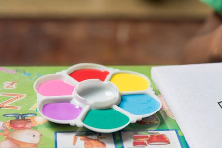 Creative ideas and learning. Education concept. Child's hands drawing. Colorful picture made by kids.の写真素材