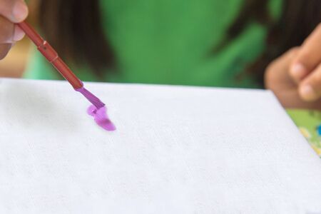 Creative ideas and learning. Education concept. Child's hands drawing. Colorful picture made by kids.の写真素材