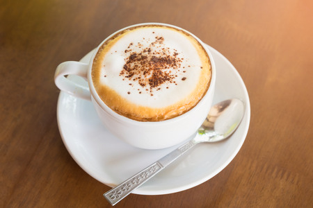 cup of coffee on table in cafe ,Morning light, Cappuccino in a white cup on the tableの写真素材