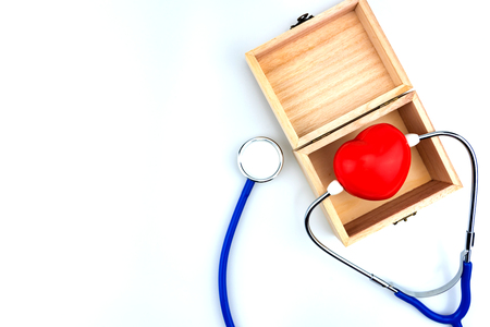 Blue stethoscope isolated and red heart on white background. Medical stethoscope and red heart isolated on whiteの写真素材